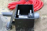 Boitier de filtration ouvert pour la maintenance.